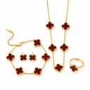 AI-generated product illustration of the Luminity London 4 Clover Bundle in Red wine, showing necklace, bracelet, earrings and ring.