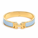 AI-generated illustrative H Gold Bracelet in Baby Blue enamel with Gold finish