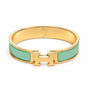 AI-generated illustrative H Gold Bracelet in Green enamel with Gold finish