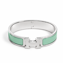 AI-generated illustrative H Gold Bracelet in Green enamel with Silver finish