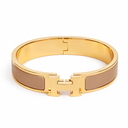 AI-generated illustrative H Gold Bracelet in Light Brown enamel with Gold finish