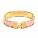 AI-generated illustrative H Gold Bracelet in Pink enamel with Gold finish