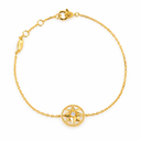 Gold-tone fine chain bracelet with a star medallion and a clear-stone centre. White background.