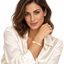 Female model wearing the white and gold H Gold Bracelet – Luminity London